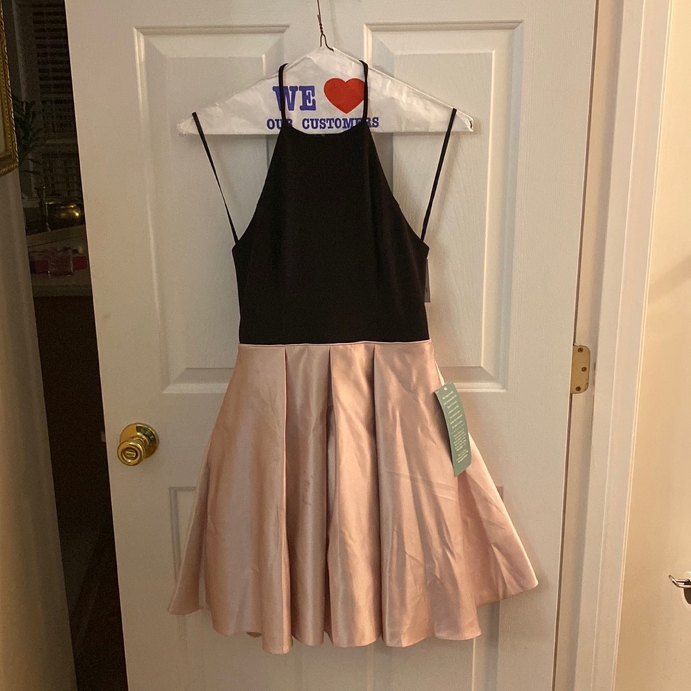 Size 5 Junior Girls Party/Formal wear. Gorgeous dress brand new with tags.
